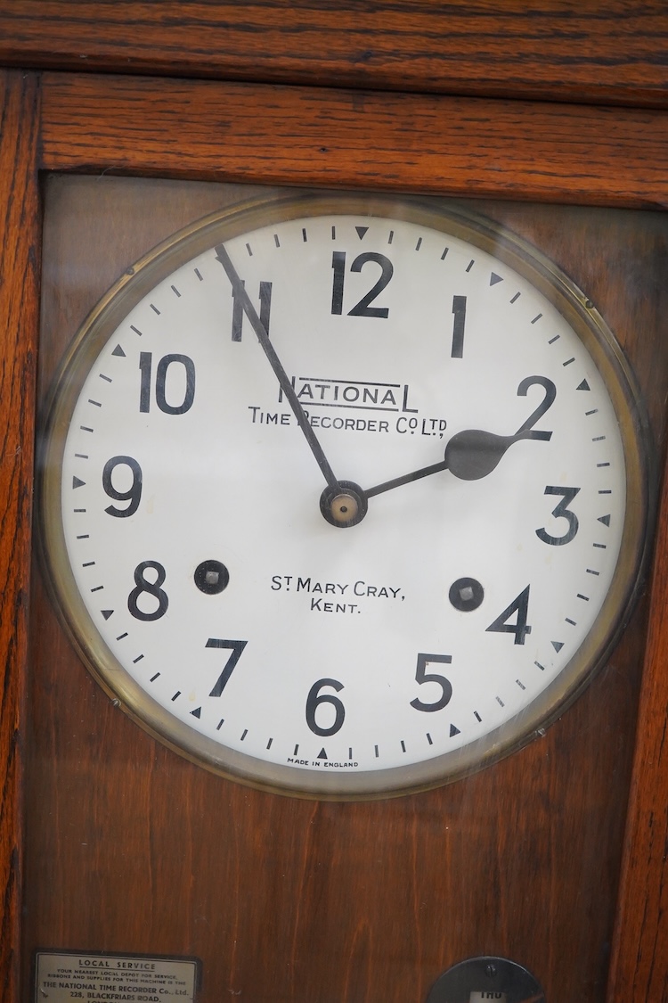 A National Time Recorder Co. Ltd. clocking in clock, 109cm high